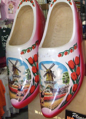 giant wooden shoes with windmills painted on them giant wooden shoes with windmills painted on them